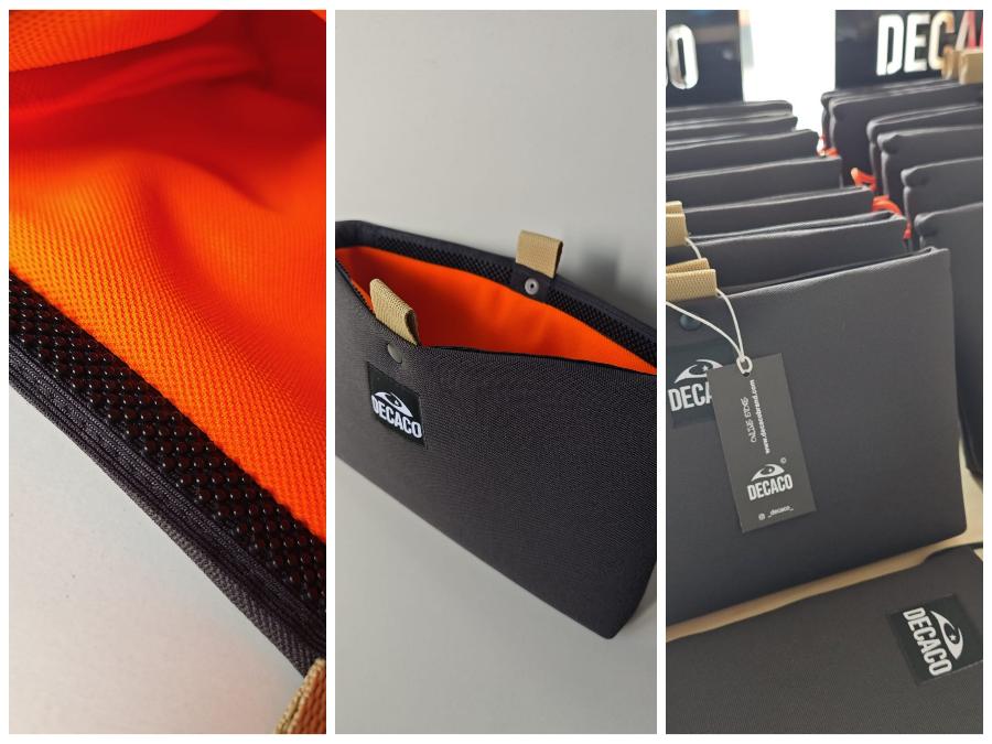 ¡Organiza tus esenciales con estilo! Este práctico neceser combina un exterior elegante en color antracita con un llamativo interior naranja. Su cierre original y su amplio espacio interior lo convierten en el compañero ideal para tus viajes o para mantener tus productos de belleza siempre ordenados.