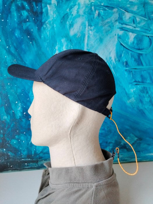 Retenedor de gorra