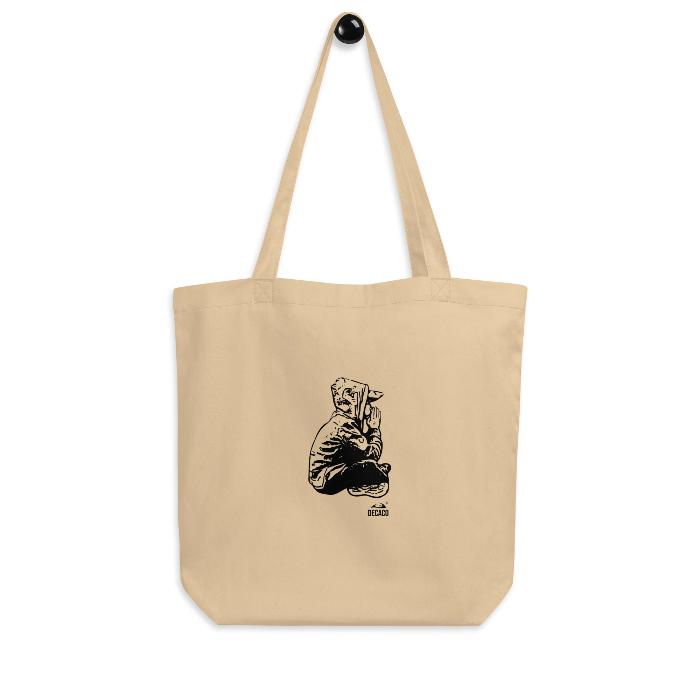 Tote bag de algodón orgánico con diseño de un niño meditando.